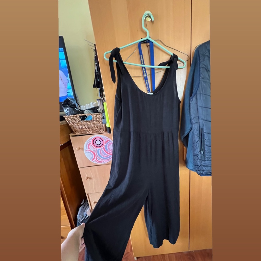 Black Sleeveless jumpsuit with pockets and bow and tie